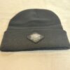 Image of the black “We Will Resist” rolled beanie by Slash-32 with a diamond-shaped patch featuring the /32 microchip symbol sewn in.