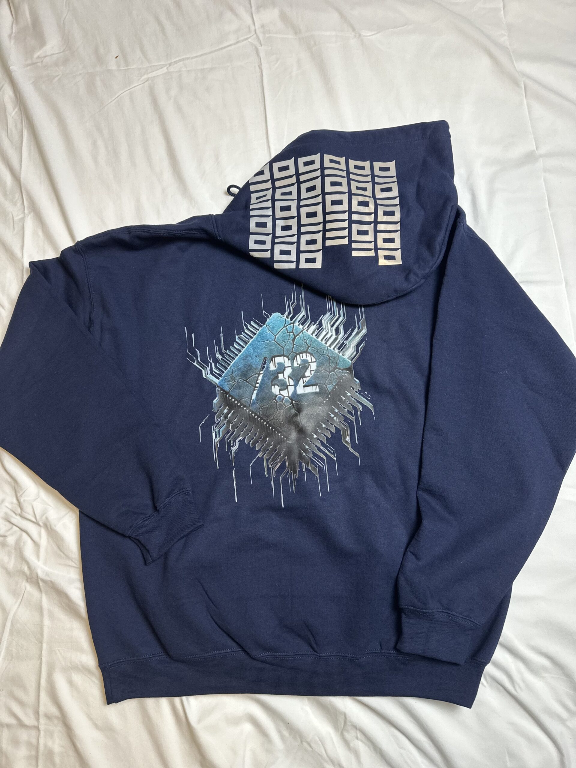 Image of FH0 – Kn0wn H0st’s Binary Hoodie by Slash-32 in Navy Blue, featuring /32 microchip graphic on back and custom binary signature on the hood.