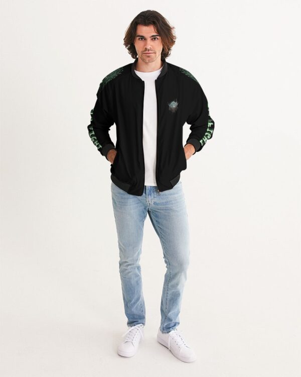 Front view of male model wearing the men’s ‘We Will Fight’ Black Label jacket from Slash-32’s Preamble Collection, hands in pockets. A streetwear piece symbolizing defiance and digital freedom.