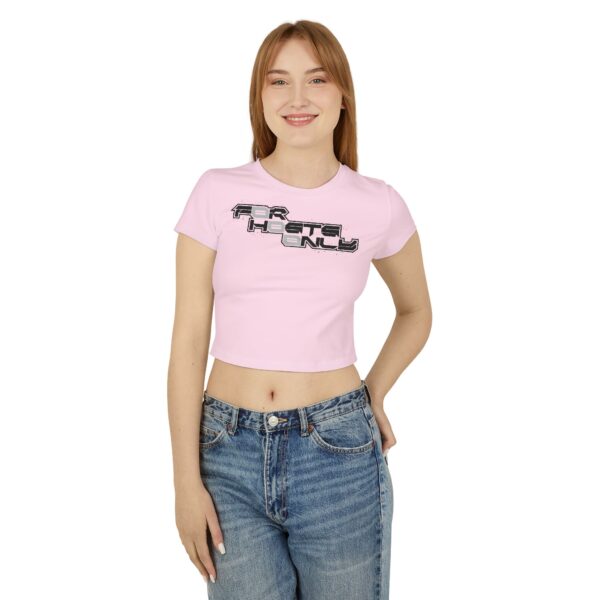 Front view of female model wearing the pink Dev Cotoure: F0r H0sts 0nly Women’s Crop Tee, hand in back pocket, featuring a bold digital slogan reading “F0r H0sts 0nly.” Designed for the Unknown Host for ladies—soft on the surface, hard coded beneath—this tee blends feminine strength with cyber identity and inner strength.