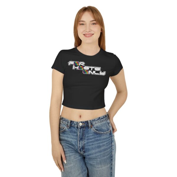 Front view of female model wearing the black Dev Cotoure: F0r H0sts 0nly Women’s Crop Tee, hand in back pocket, featuring a bold digital slogan reading “F0r H0sts 0nly.” Designed for the Unknown Host for ladies—soft on the surface, hard coded beneath—this tee blends feminine strength with cyber identity and inner strength.