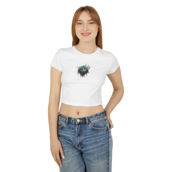 Front view of female model wearing the white ‘We The People’ Ladies Baby Tee from Slash-32’s Preamble Collection. Features a microchip symbol graphic representing digital unity, connectivity, and togetherness in the tech age. Ideal for tech enthusiasts and those embracing the future of digital culture.