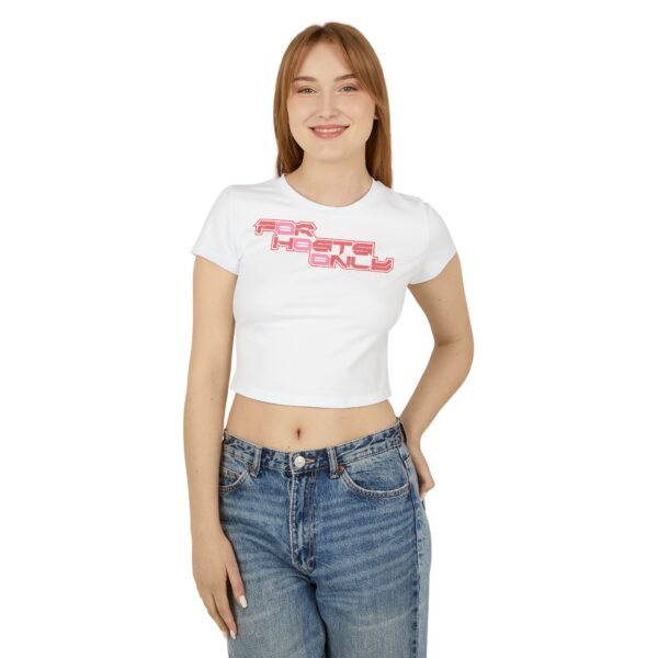 Front view of female model wearing the white Dev Cotoure: F0r H0sts 0nly Women’s Crop Tee, hand in back pocket, featuring a bold digital slogan reading “F0r H0sts 0nly.” Designed for the Unknown Host for ladies—soft on the surface, hard coded beneath—this tee blends feminine strength with cyber identity and inner strength.