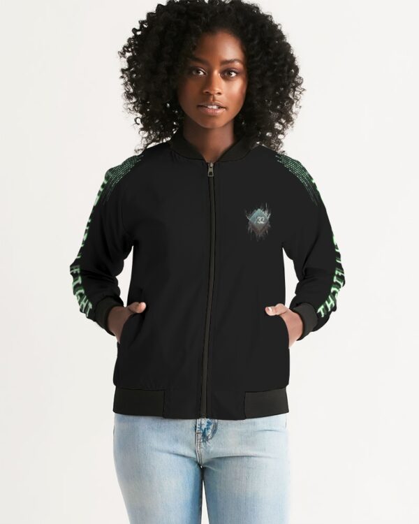 Front view of female model wearing Slash-32’s women’s ‘We Will Fight’ Black Label Jacket, a durable and comfortable bomber inspired by Infrawear, designed for streetwear and cybersecurity enthusiasts.