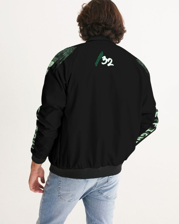 Back view of male model wearing the men’s ‘We Will Fight’ Black Label jacket from Slash-32’s Preamble Collection — a streetwear piece symbolizing defiance and digital freedom.