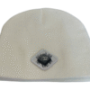 Image of white skull cap style fitted beanie with diamond-shaped white patch featuring microchip symbol and “/32” text, sewn onto front of hat.