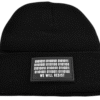 Close-up image of the black “We Will Resist” rolled beanie by Slash-32, showing the grey rectangle patch with binary matrix and “We Will Resist” text.