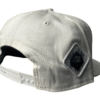 Side-back view image of Slash-32 9/50 Snapback hat, White showing the white diamond-shaped /32 microchip patch.