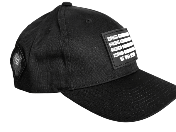 Image of Slash-32 Ladies Snug Black "We Will Resist" Snapback Cap, side view showing the /32 microchip patch and binary design with “We Will Resist” text across the front.