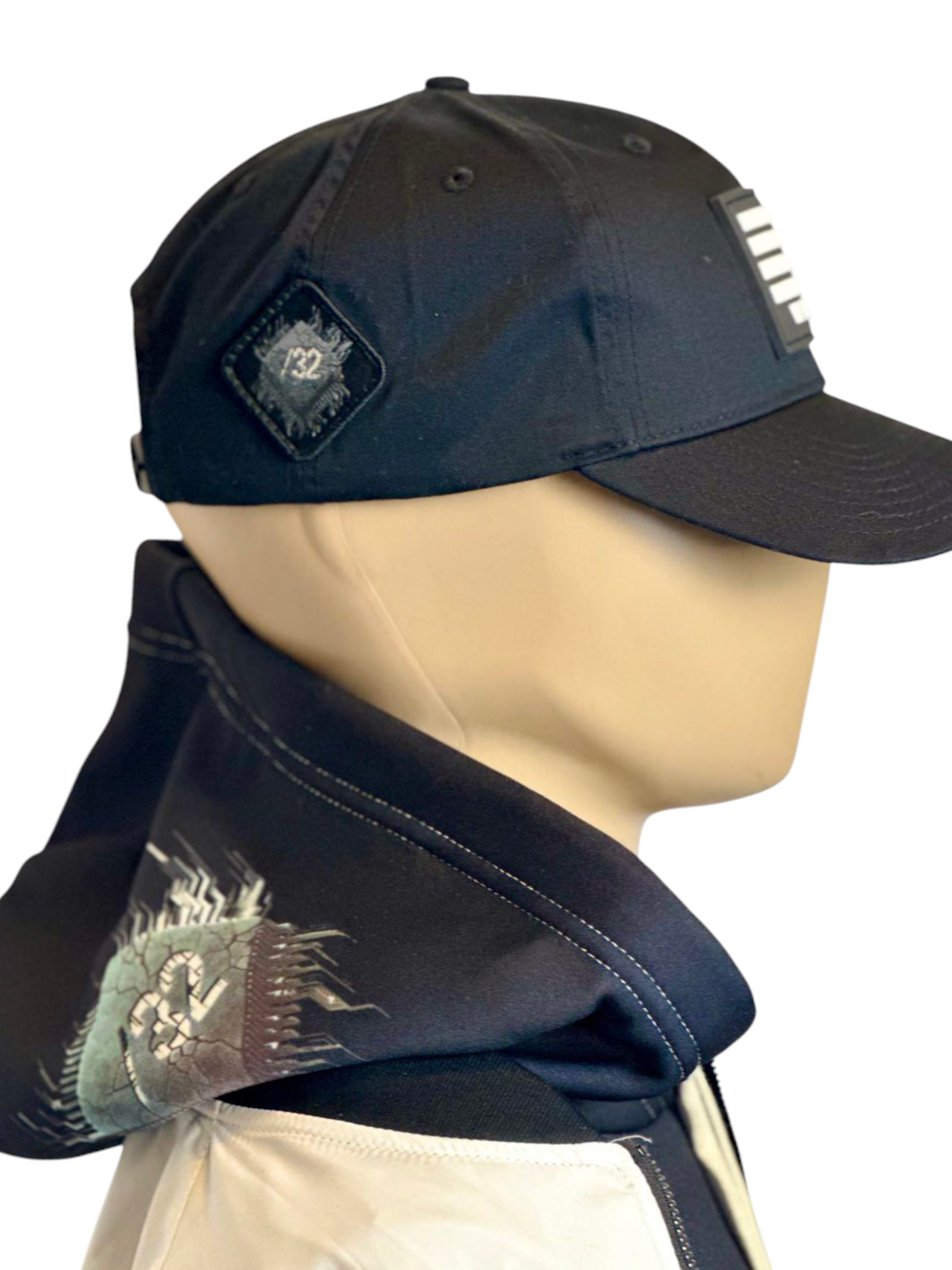 Image of Slash-32 Ladies Snug Black "We Will Resist" Snapback Cap on mannequin, featuring binary code and “We Will Resist” text on the front panel, with the /32 microchip patch sewn on the side.