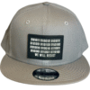Image of Slash-32 9/50 Snapback hat, Grey "We Will Resist" cap, featuring a front black rectangle patch with a binary matrix above the “We Will Resist” text.