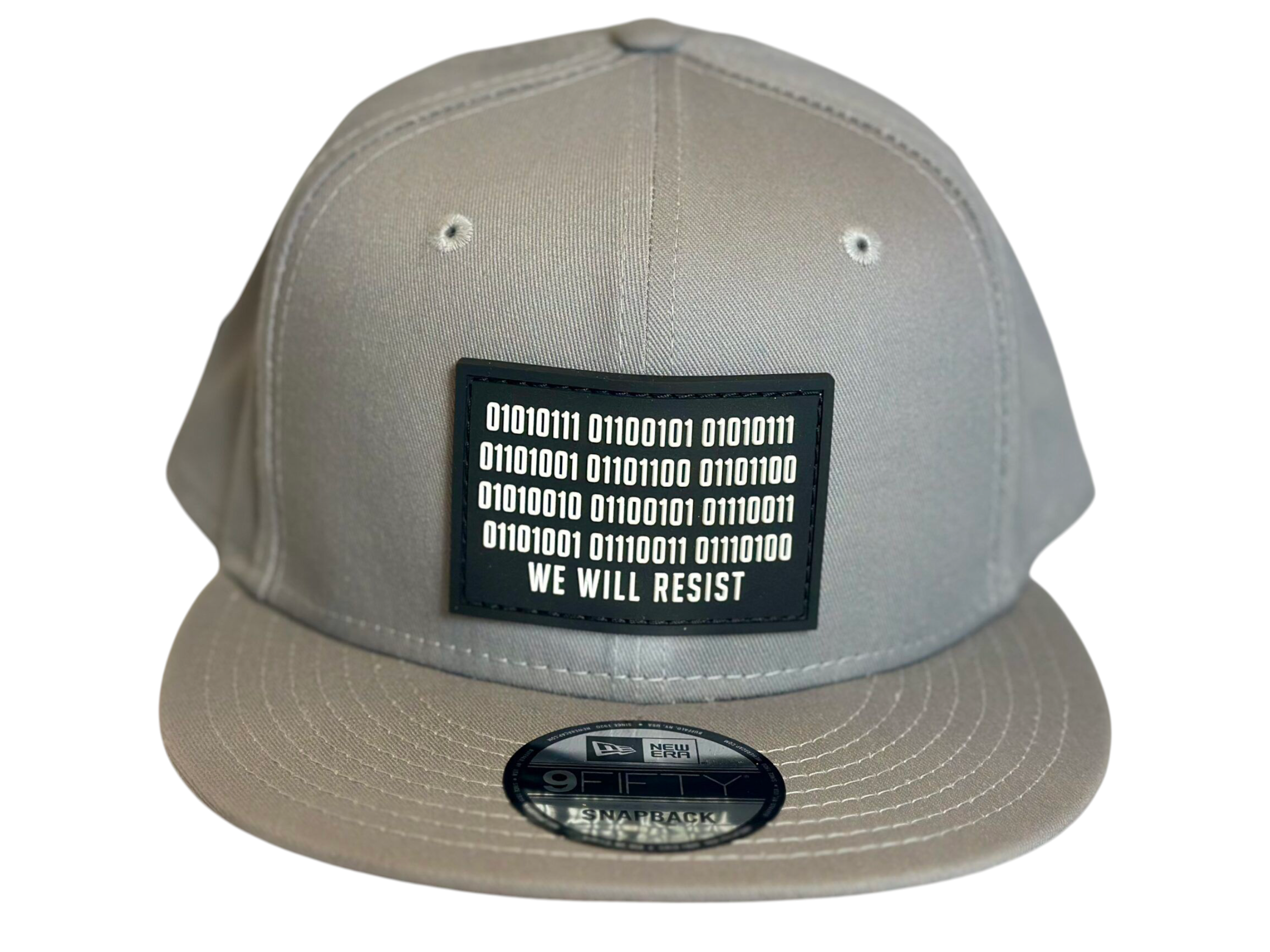 Image of Slash-32 9/50 Snapback hat, Grey "We Will Resist" cap, featuring a front black rectangle patch with a binary matrix above the “We Will Resist” text.