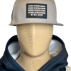 Image of mannequin wearing the Slash-32 9/50 Snapback hat, Grey "We Will Resist" cap with hoodie, showing the front patch with binary and “We Will Resist” text.