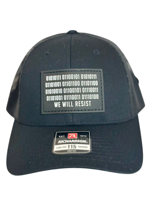 Image of Slash-32 Trucker Style Snapback hat - Black "We Will Resist" cap, front view showcasing the black rectangle patch with binary matrix and “We Will Resist” text.