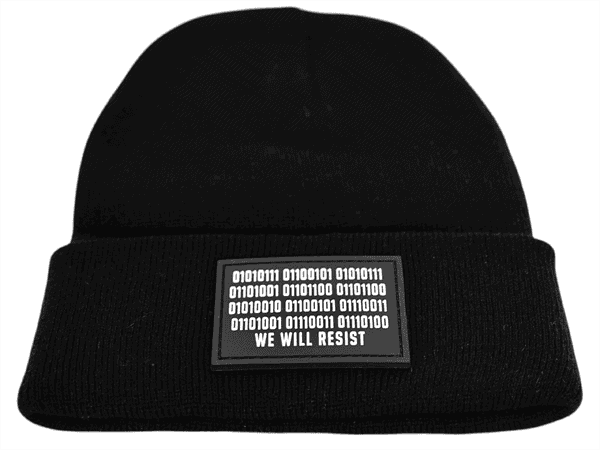 Close-up image of the black “We Will Resist” rolled beanie by Slash-32, showing the grey rectangle patch with binary matrix and “We Will Resist” text.