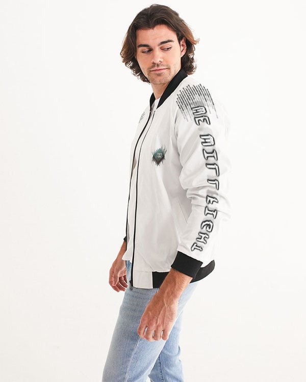 Side view of a male model wearing a black bomber jacket with “We Will Fight” text on the left sleeve.